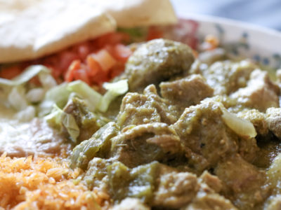 Chile Verde: Pork loin braised in a green tomatillo sauce, green peppers, onion and spices.